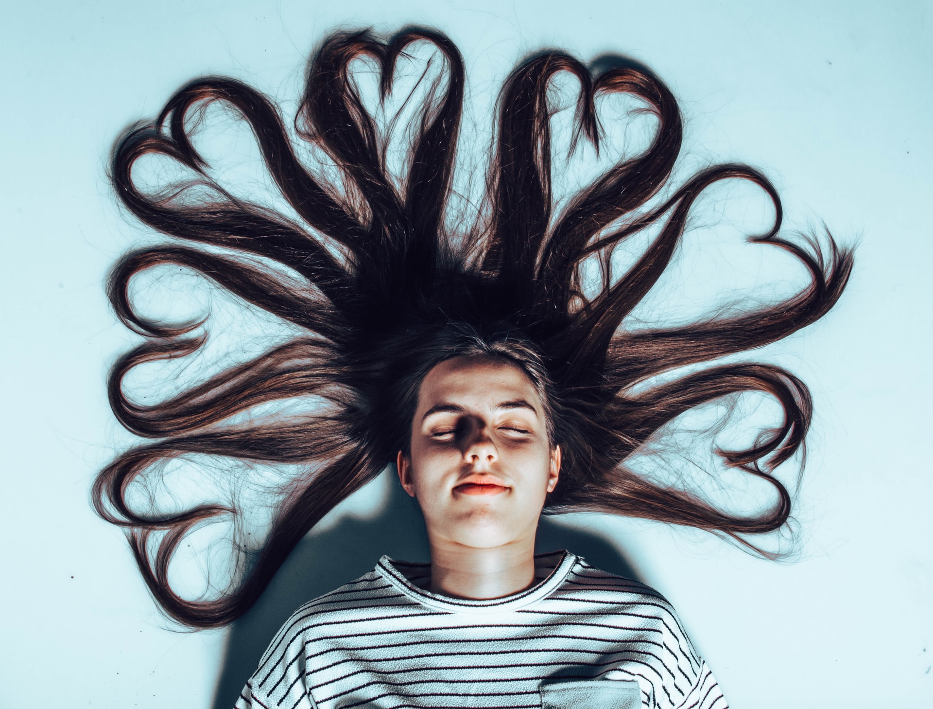 woman with long flowing on the floor